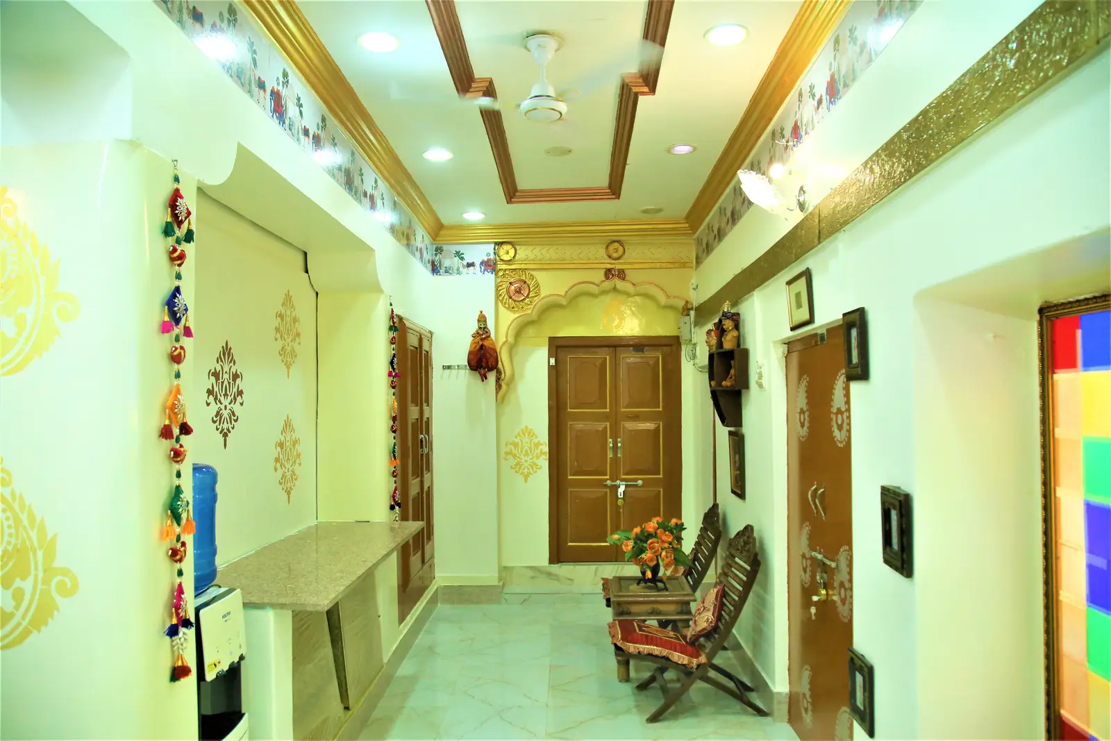 Guest corridor of the haveli with hand painted motifs, jharokha detailing and heritage bench